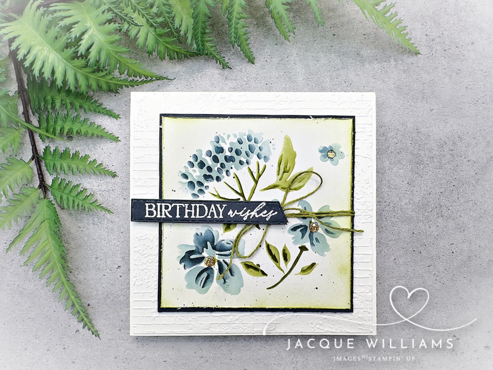 Handmade floral birthday card using Stampin’ Up! products with a quick masking technique. Features soft blue and green ink blending, layered leaves, subtle shading, and a Birthday Wishes from the 12 Days of Crafting Advent Calendar.