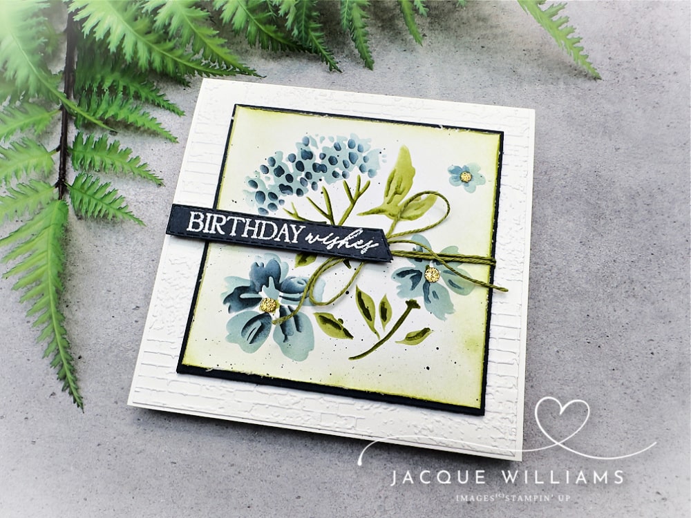 Handmade floral birthday card using Stampin’ Up! products with a quick masking technique. Features soft blue and green ink blending, layered leaves, subtle shading, and a Birthday Wishes from the 12 Days of Crafting Advent Calendar.