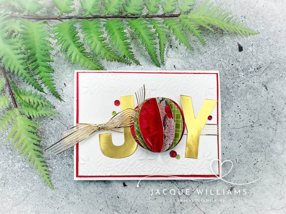 3-Dimensional Christmas card or Christmas tag with a fun way to use your a circle punch! Featuring the Traditions of Christmas papers